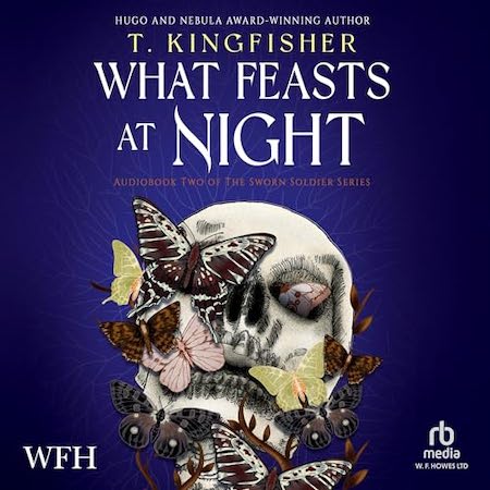 Book cover for What Feasts At Night showing a skull covered in small plants, moths and butterflies